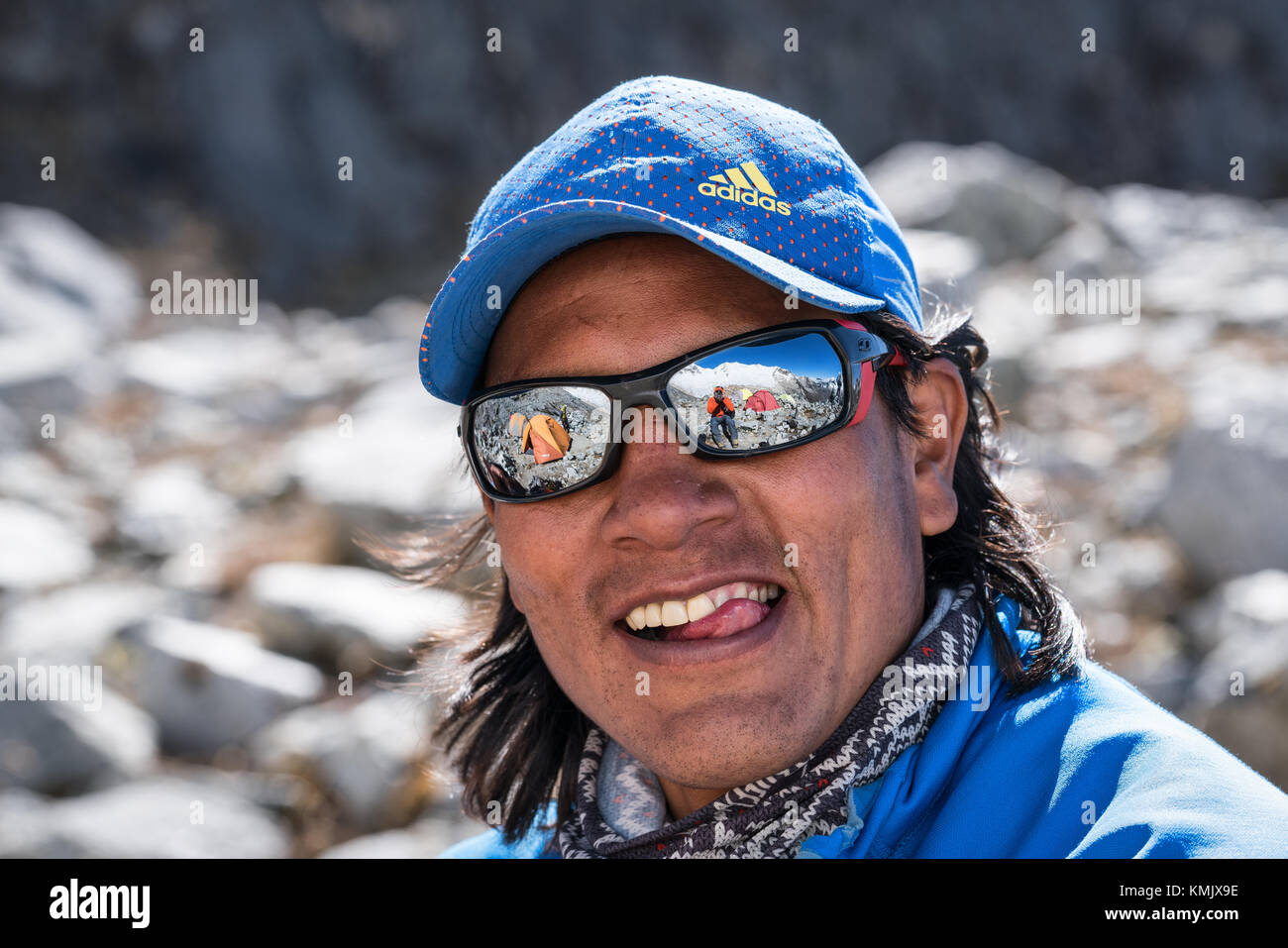 Taking it easy at the moraine/high camp of Artesonraju mountain, Santa Cruz valley, Cordillera Blanca, Peru Stock Photo