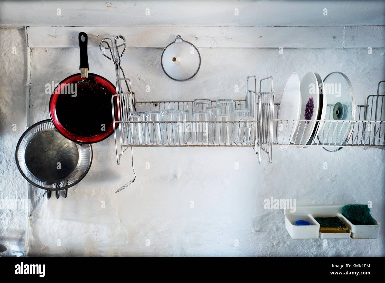 Old and simple kitchen in a fishing lodge with cooking utensils, pots