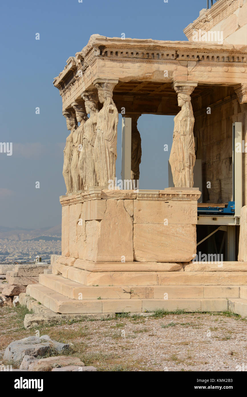 Portrait orientation view of the Erechtheion, Porch of the Maidens/Caryatids, 6 females, at the Acropolis in Athens, Greece on a sunny warm day Stock Photo
