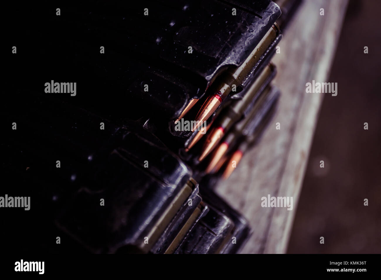 Automatic rifle cartridge with bullets on a military shooting range ...