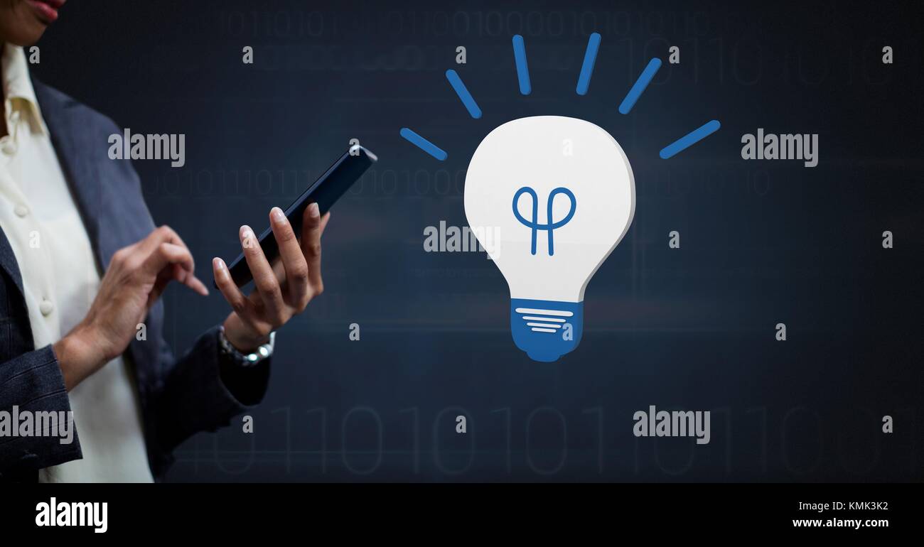 Digital composite of Hand holding device with 3D light bulb idea icon ...