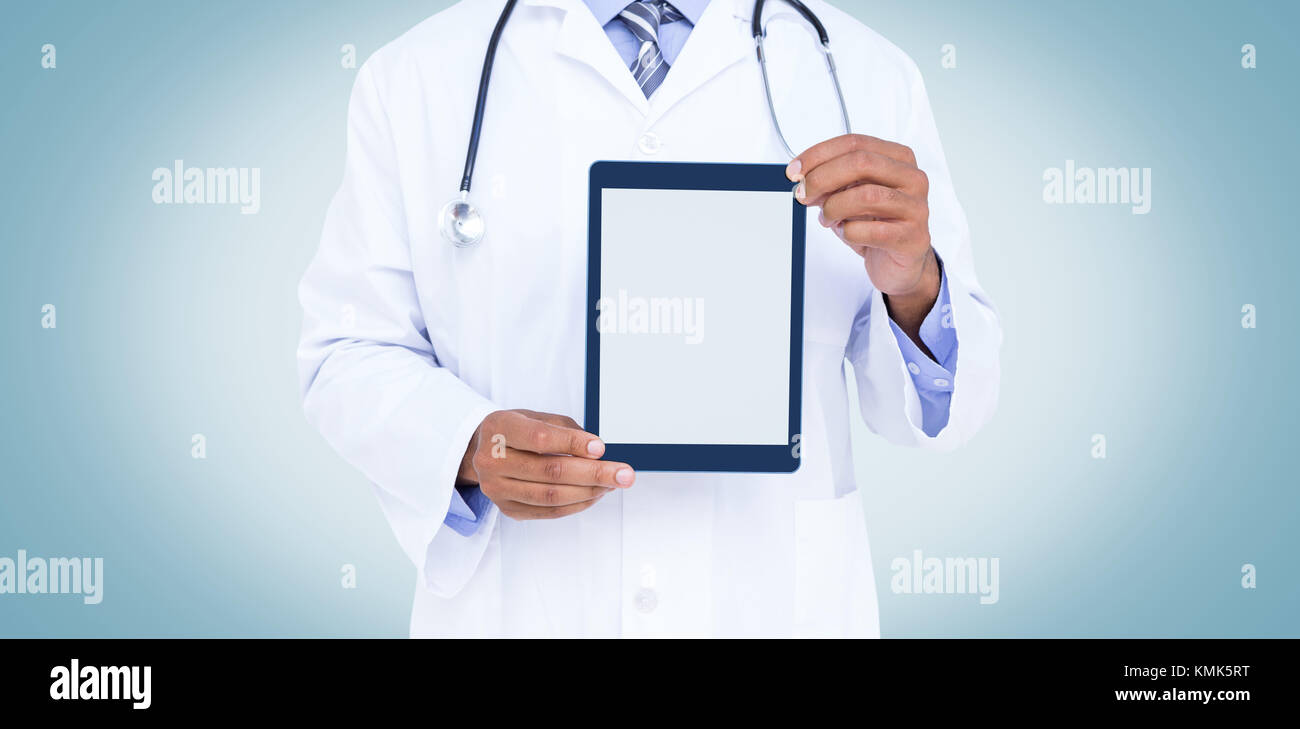 A doctor showing digital tablet on white background Stock Photo - Alamy