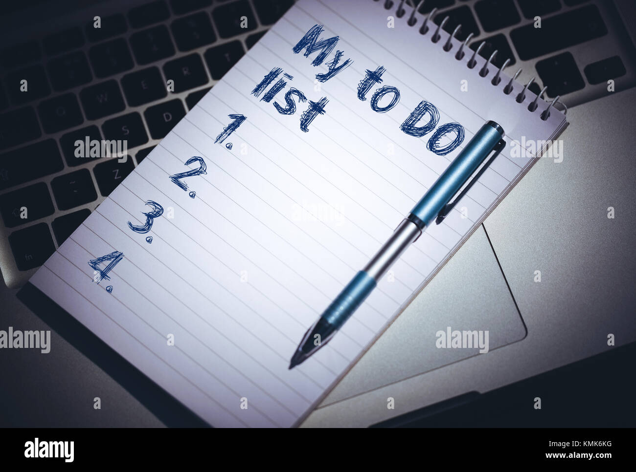 to do list from 1 to 5 against notepad on laptop Stock Photo