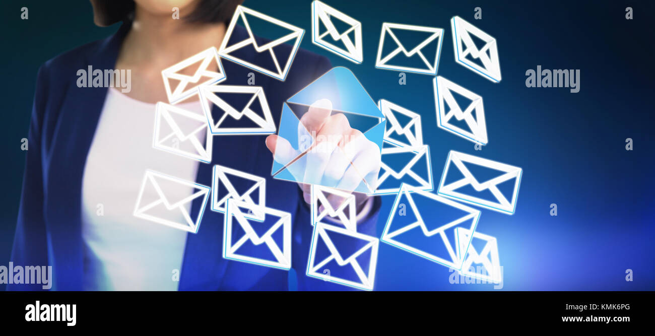 Mid section of businesswoman touching invisible screen against blue background with vignette Stock Photo