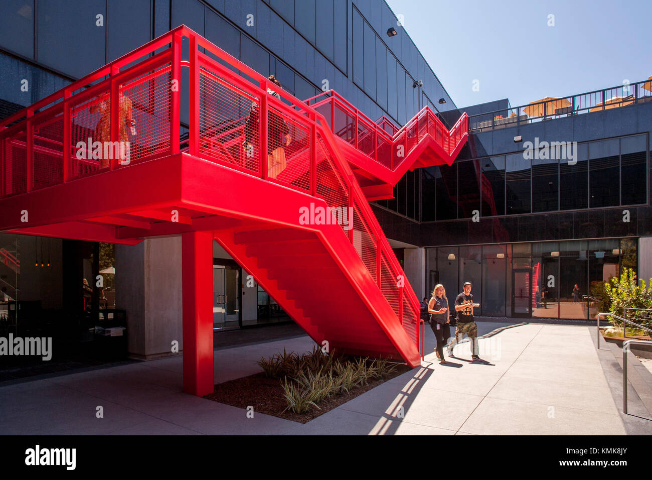 Young adult employees at the Vans Shoe Company corporate headquarters in  Costa Mesa, CA, use an outdoor staircase in the building's central  courtyard Stock Photo - Alamy