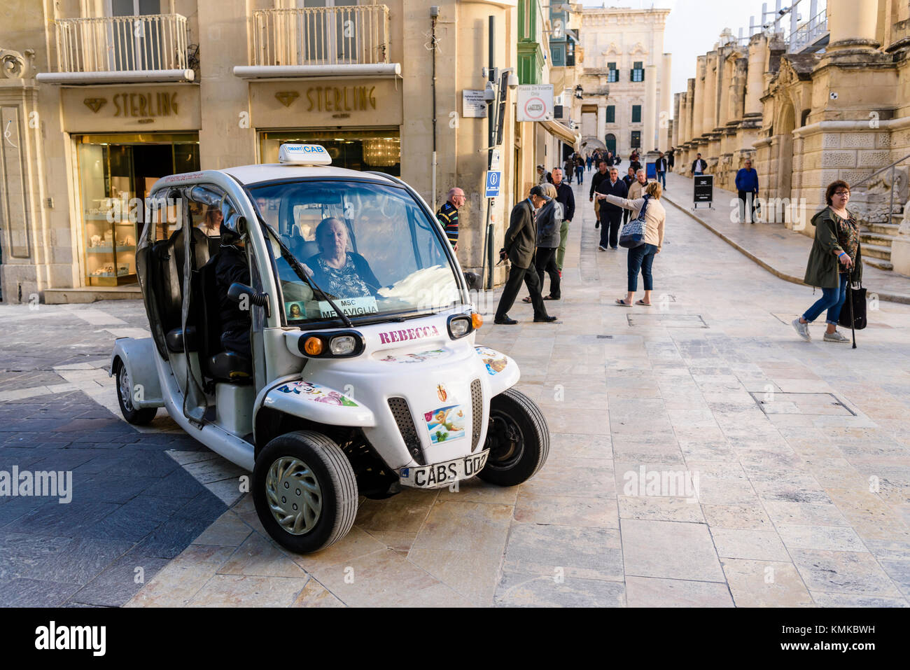 Electric city cab taxi on the streets of Valletta, Malta Stock Photo