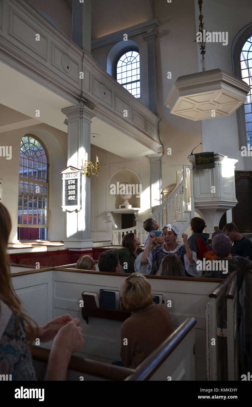 Costumed guide and tourists inside Old North Church, The Freedom Trail, Boston, Mass, USA Stock Photo