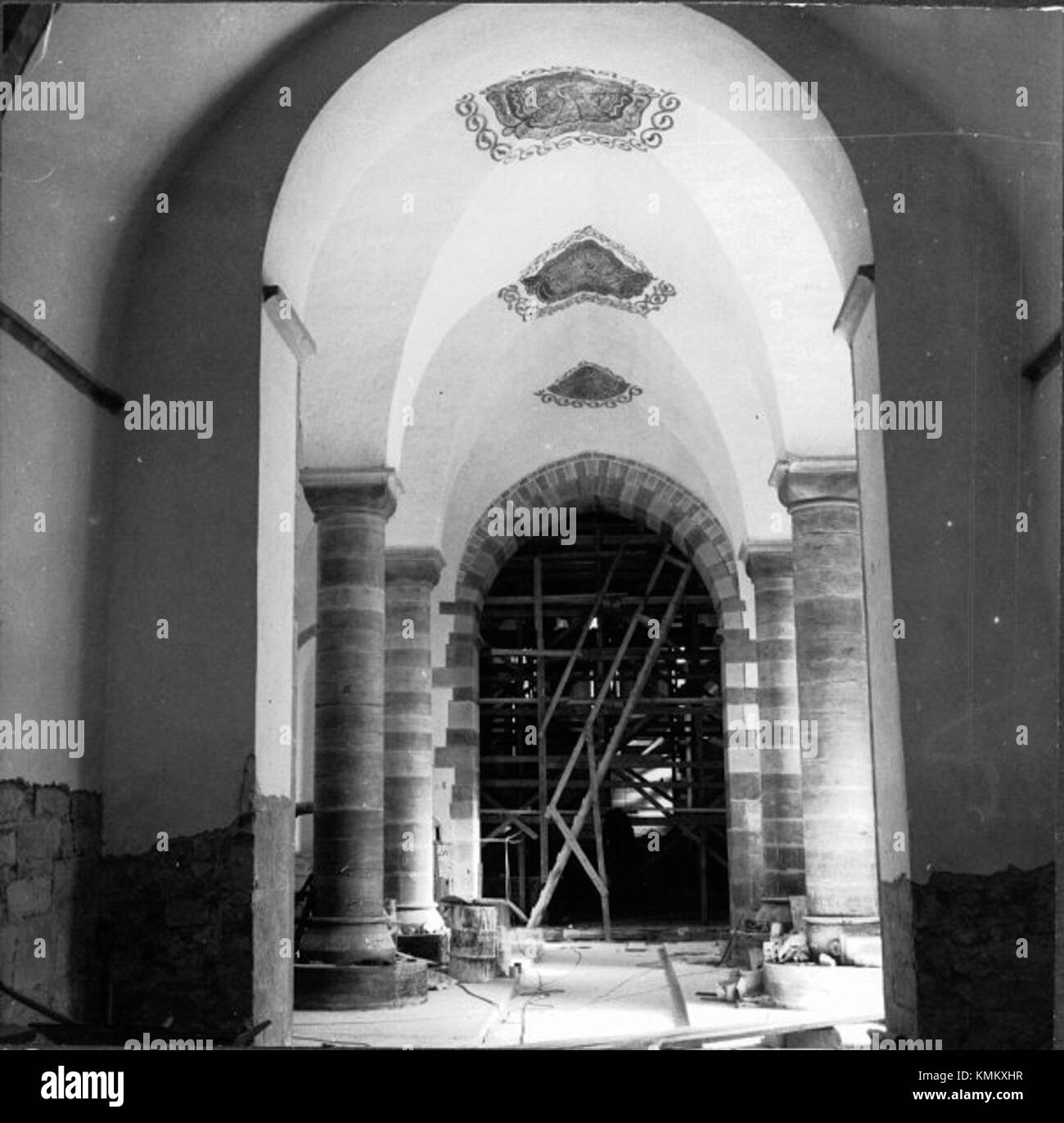 Photograph of Vamlingbo Church, cataloged under KMB number 16000200030025. Located in southern Gotland, Sweden, this medieval hall church features alternating red and grey limestone pillars and murals depicting the Archangel Michael weighing the soul of Emperor Henry. The church's tower, added in the 14th century, was rebuilt in 1820 after storm damage. Stock Photo