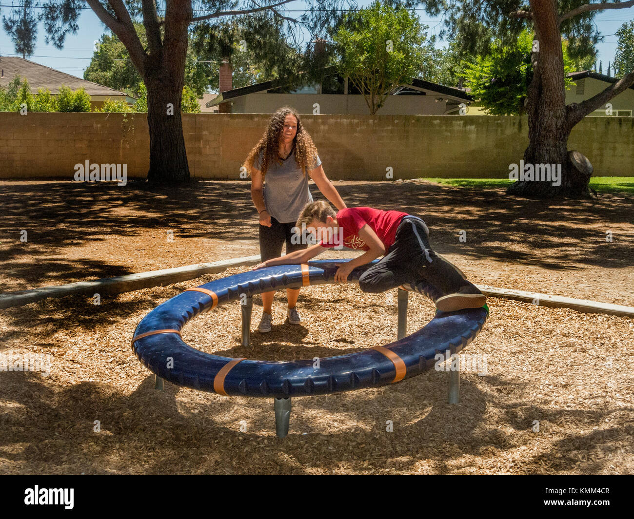 Teen boy and girl in playground hi-res stock photography and images - Alamy