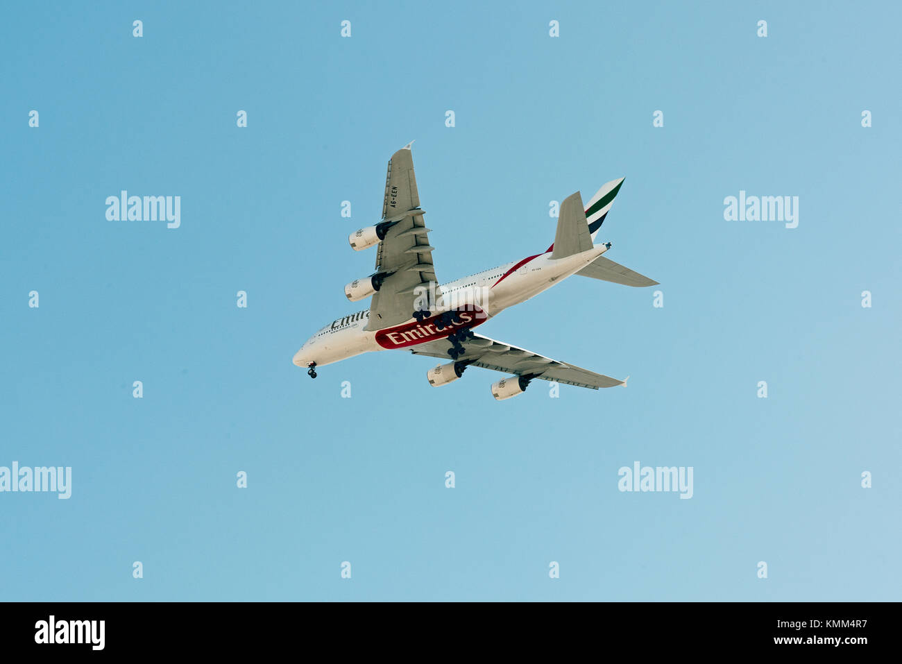 Emirates Airbus A380 on glide path to landing at Jeddah International airport. Quick photo taken from street level in district under flight-path. Stock Photo