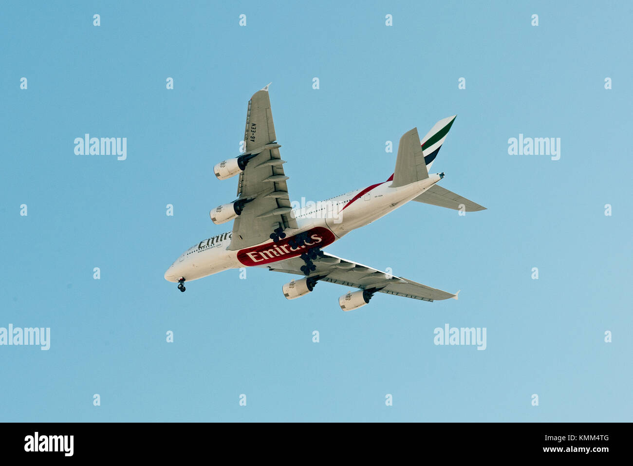 Emirates Airbus A380 on glide path to landing at Jeddah International airport. Quick photo taken from street level in district under flight-path. Stock Photo