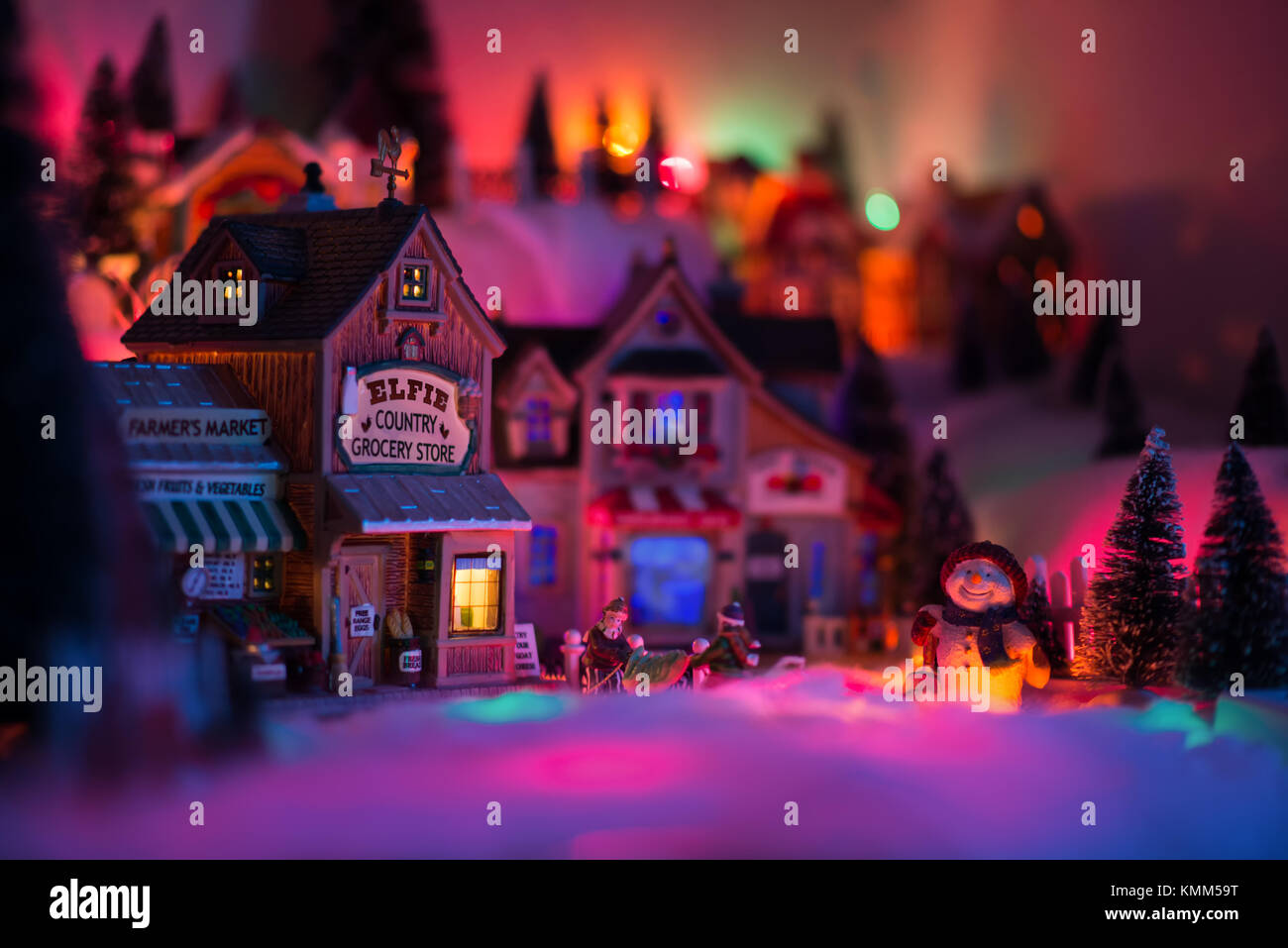 Christmas Times In Fairy Tale Town Of Elf Miniature Figurines With Happy Snowman Standing While Other Two Persons Stacking Fishes From Harvesting In M Stock Photo Alamy
