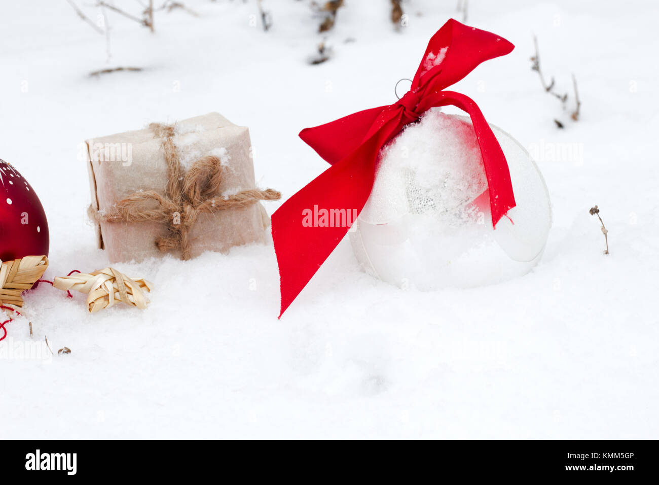 Red and silver christmas ball and Christmas gift ornament on snow ...