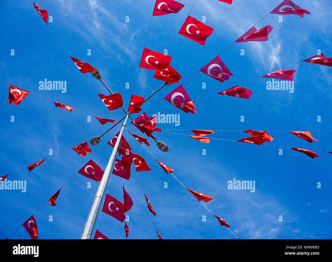 Mast with small turkish national flags against blue sky, Kaleici, old town of Antalya, turkish riviera, Turkey Stock Photo