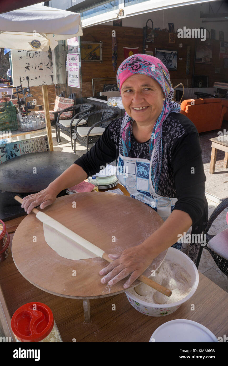 Turkish woman prepares Pide (flat bread) at the old town of Side, turkish riviera, Turkey Stock Photo
