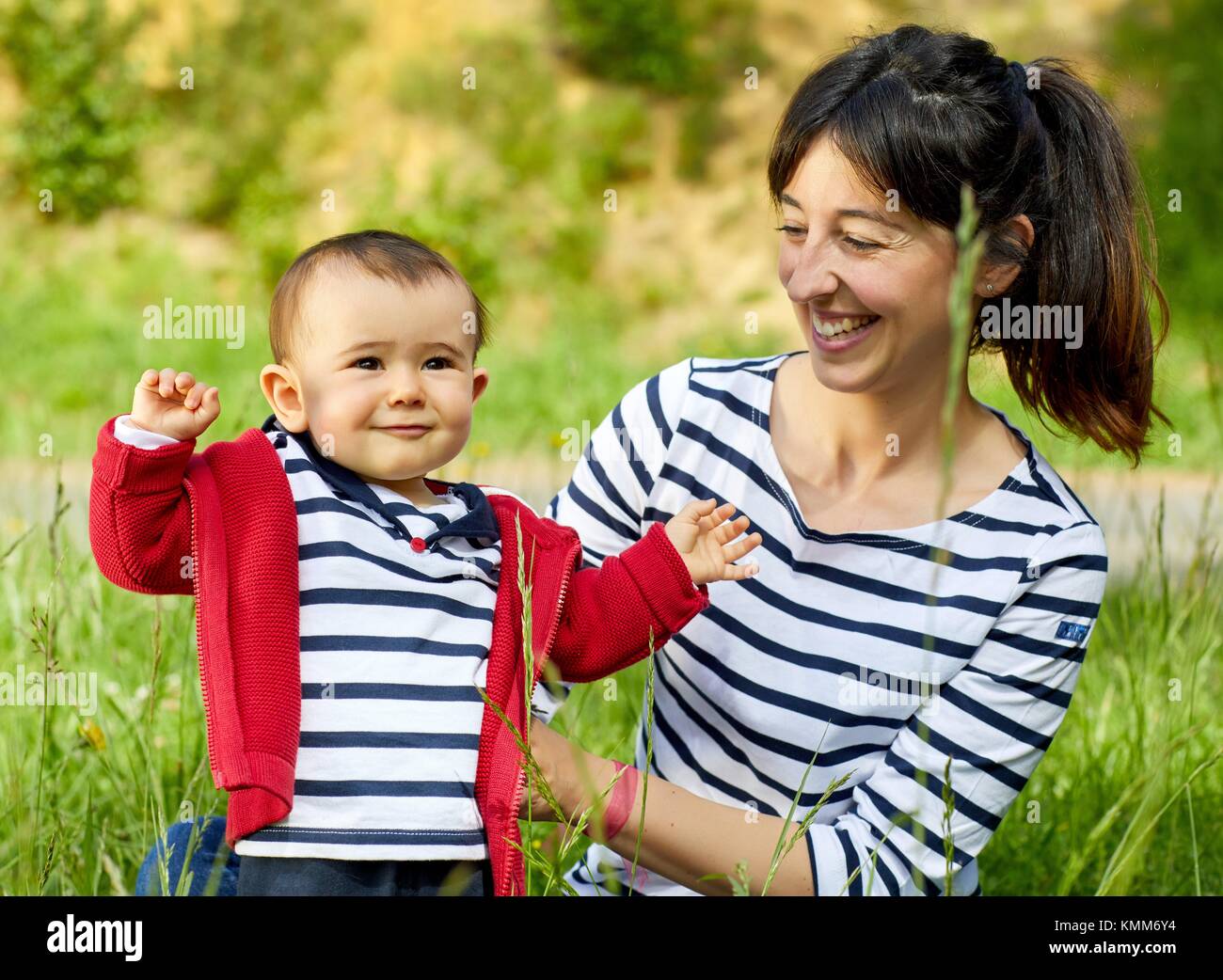 Mother and baby in the park, Getaria, Gipuzkoa, Basque Country, Spain Stock Photo