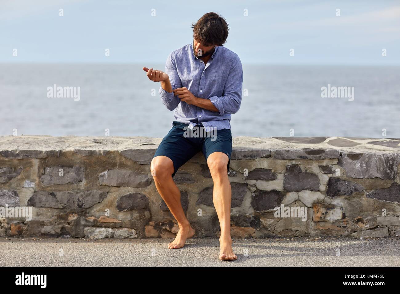 Young man, Port of Guethary, Aquitaine, Pyrenees Atlantiques, Basque Country, France, Europe Stock Photo