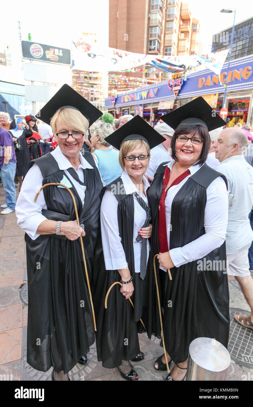 Benidorm new town British fancy dress day group of women dressed as school teachers with whips and mortar boards Stock Photo