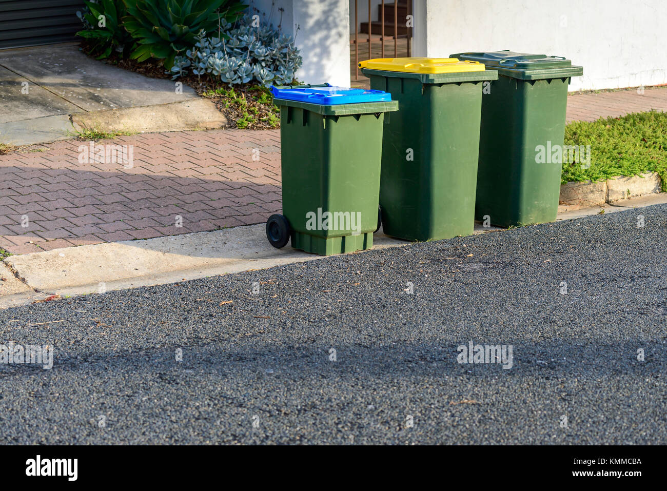 Kerbside waste bins ready for collection by local council in Australian suburb Stock Photo