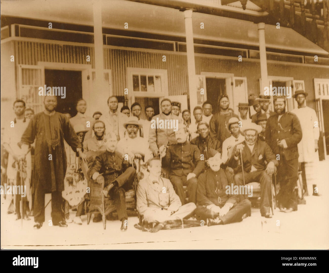 This photograph from 1896 shows the Bonny Chiefs alongside the Naval Commandant of the Coast of Biafra and the Bight of Benin, highlighting the historical military and cultural ties between the local leadership and naval officers. Stock Photo