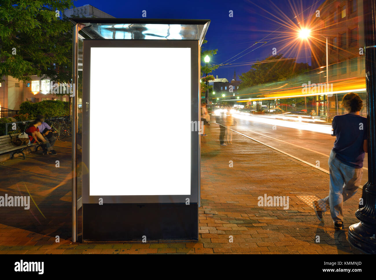 Bus shelter billboard at night Stock Photo