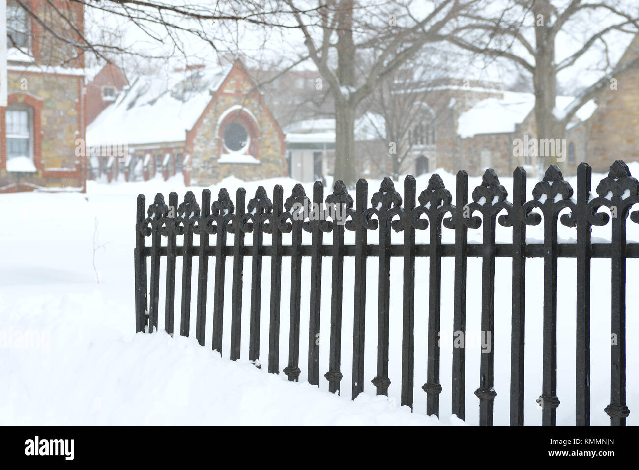 Cast iron fence burried in snow. Winter background Stock Photo
