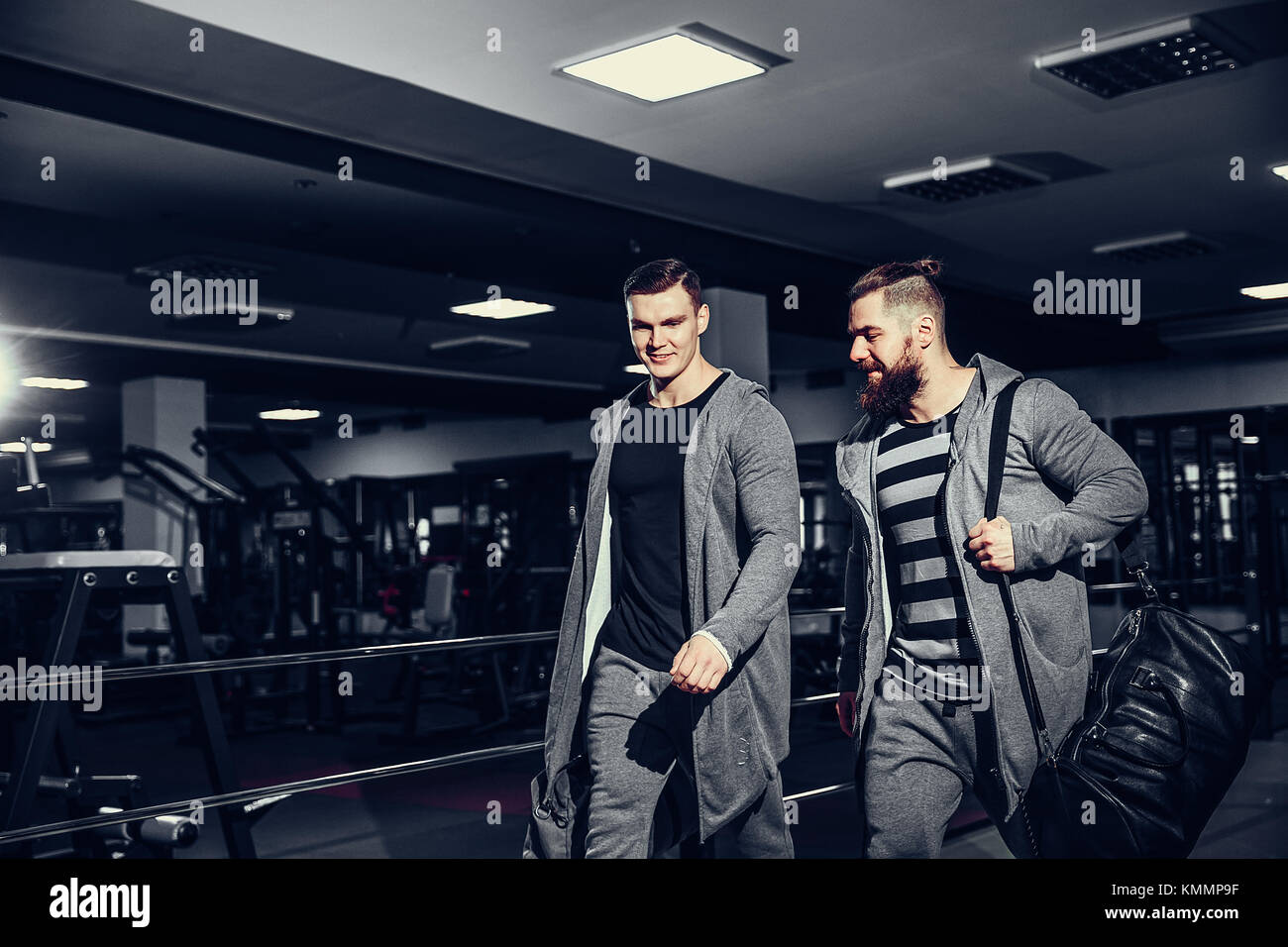 Confident young sportsmen leaving gym Stock Photo