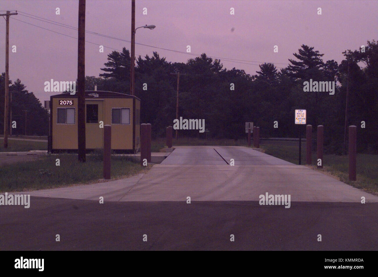 The scale house, building 2075, and scale are shown August 2000 at Fort