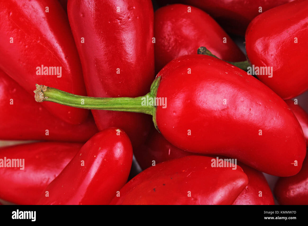 Red chili. Fresh spice vegetable. Strong hot red chili paprika pepper. Little aleppo chili paprika pepper texture pattern closeup background. Stock Photo