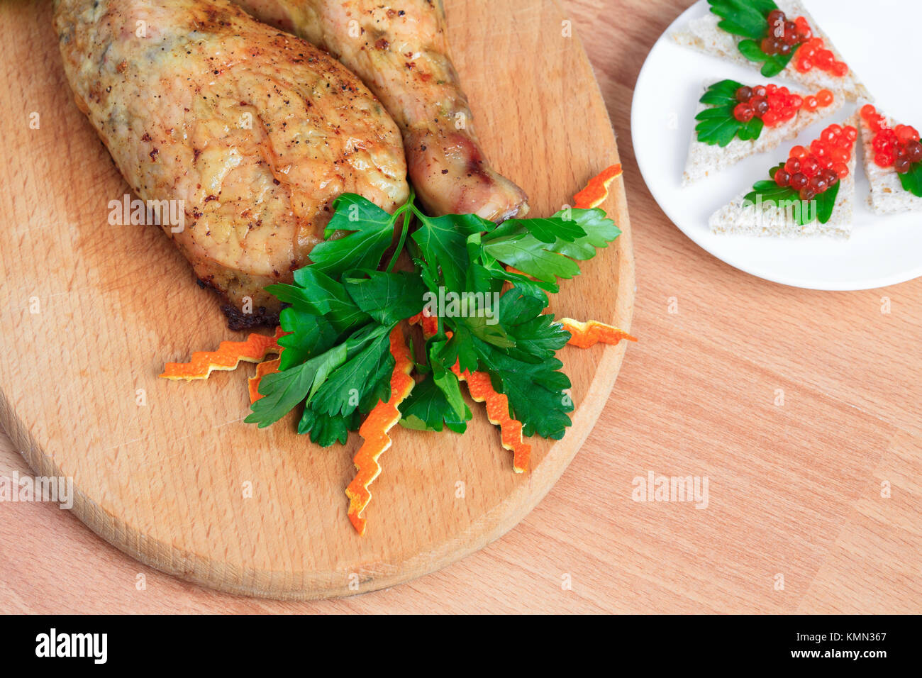 Fried chicken legs with parsley and red caviar Stock Photo Alamy