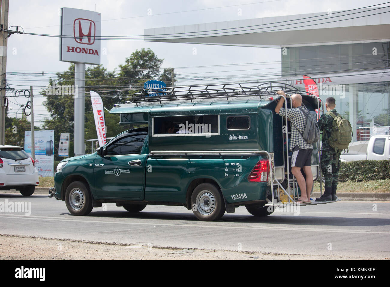 CHIANG MAI, THAILAND -NOVEMBER 28 2017: Green Pickup truck taxi Chiangmai, Isuzu Pickup truck.  On road no.1001, 8 km from Chiangmai Business Area. Stock Photo