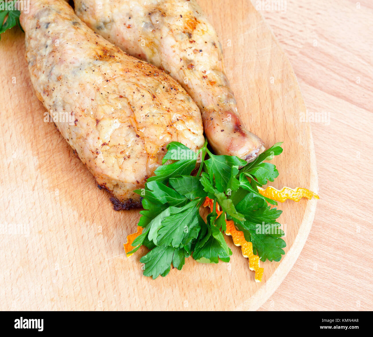 Fried chicken legs with parsley on the board Stock Photo Alamy