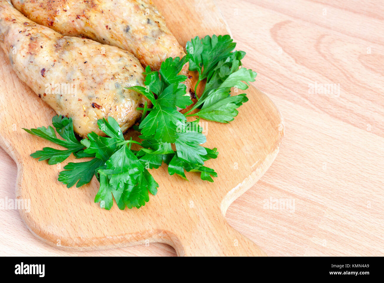 Fried chicken legs with parsley on the board Stock Photo Alamy