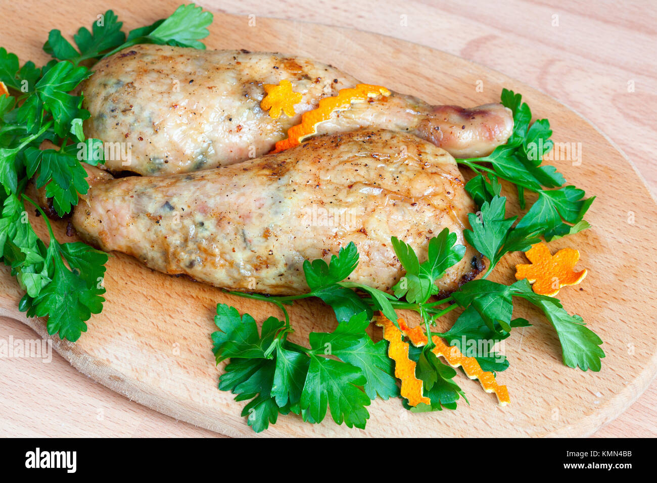 Fried chicken legs with parsley on the board Stock Photo Alamy