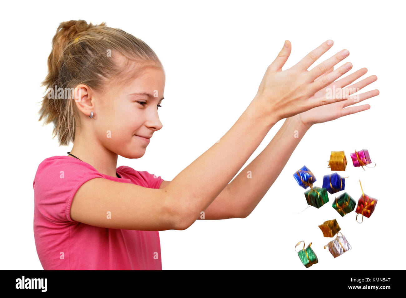 The girl throws miniature gifts, conceptually isolated on white Stock