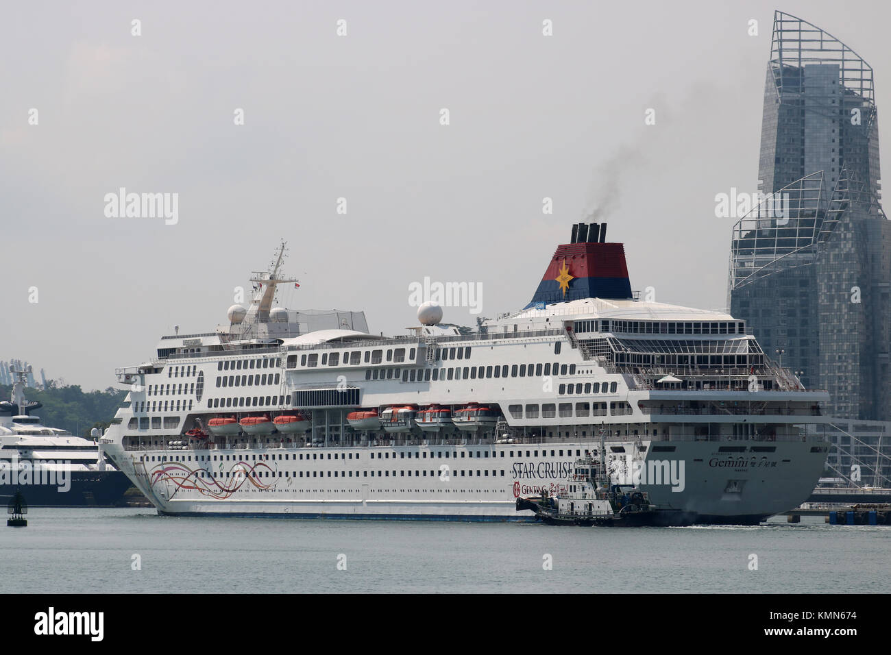 Star Cruises ship Gemini docked in Singapore harbour with skyscraper at  Vivo City retail area in background Stock Photo - Alamy