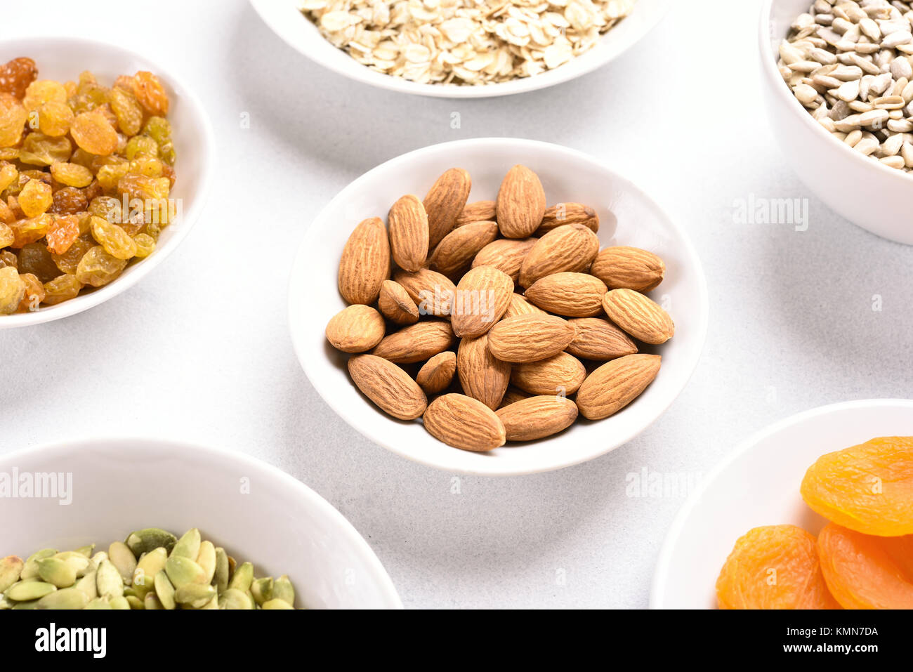 Ingredients for cooking granola on white background. Stock Photo