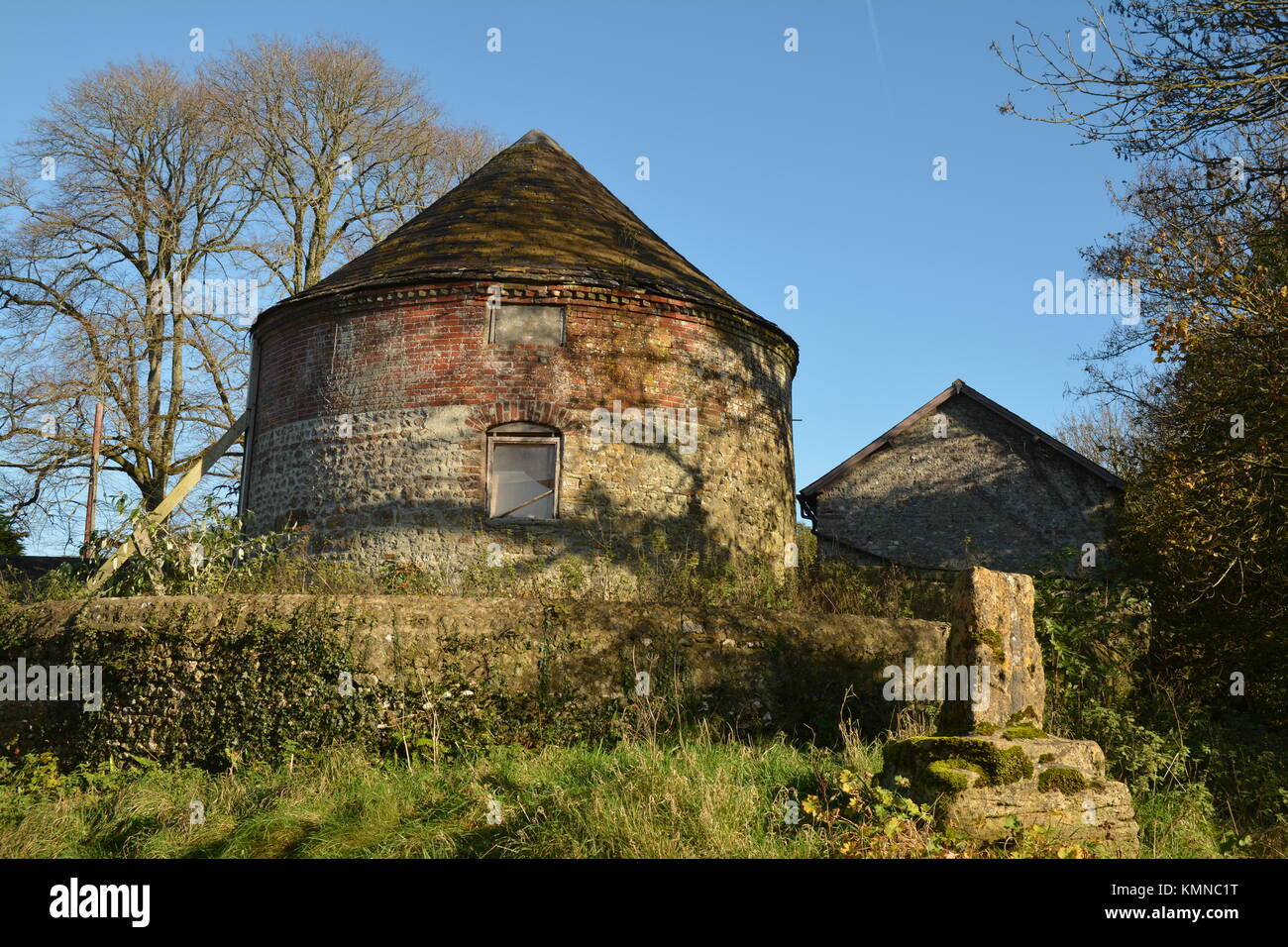 Round country barn with conical roof Stock Photo