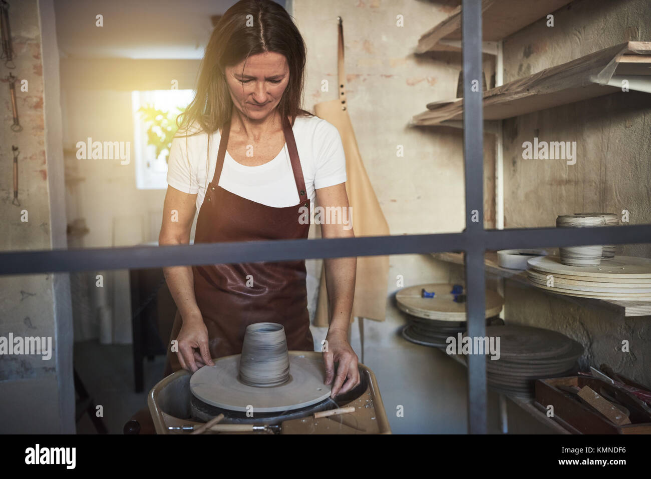 Female Artisan Standing Alone In Her Creative Studio Shaping A Wet Stock Photo Alamy