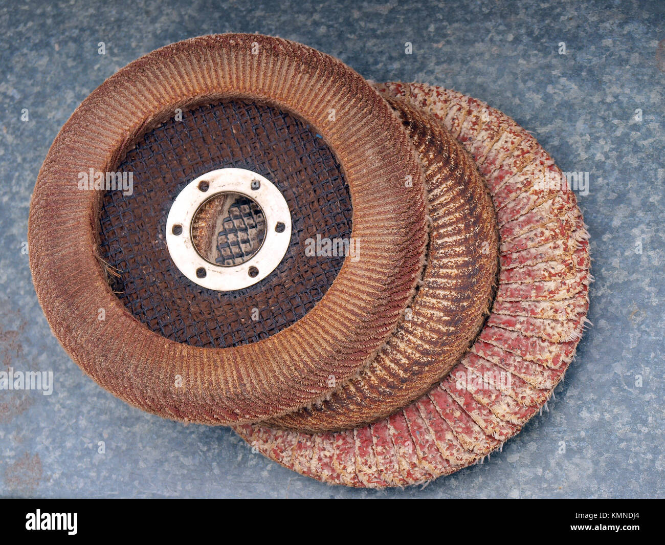 Angle grinder sanding discs fom lot of sandpaper pieces Stock Photo - Alamy