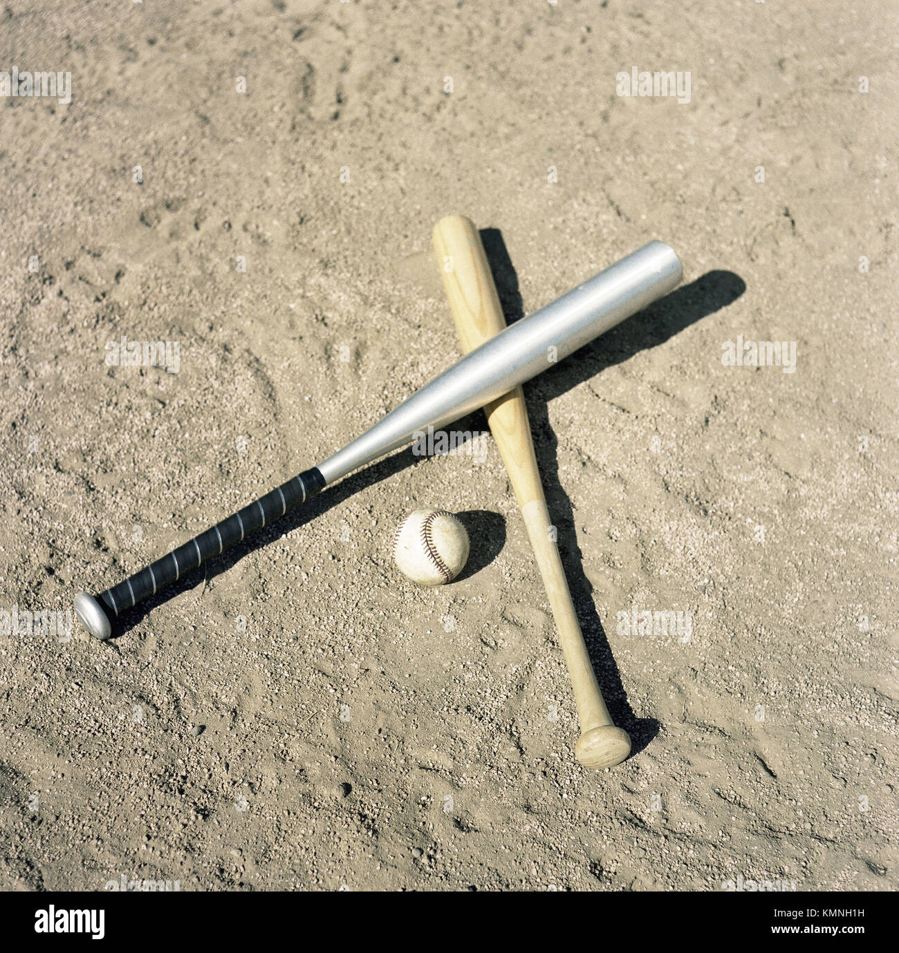 Baseball bats and ball on baseball field Stock Photo Alamy