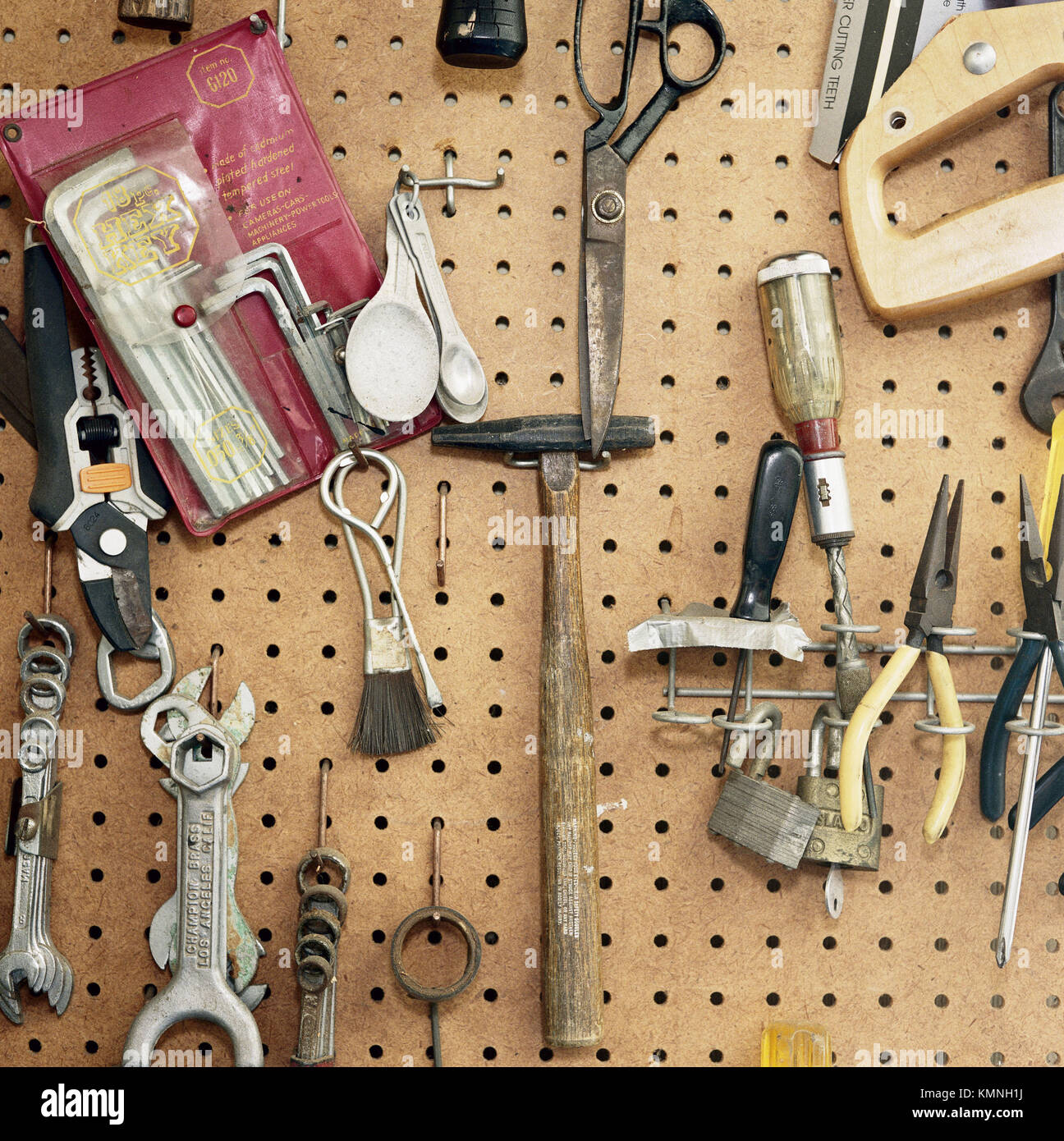 Tools hanging on pegboard Stock Photo Alamy