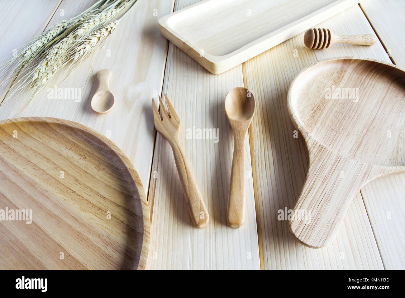 Wooden kitchen utensils on wooden background Stock Photo - Alamy