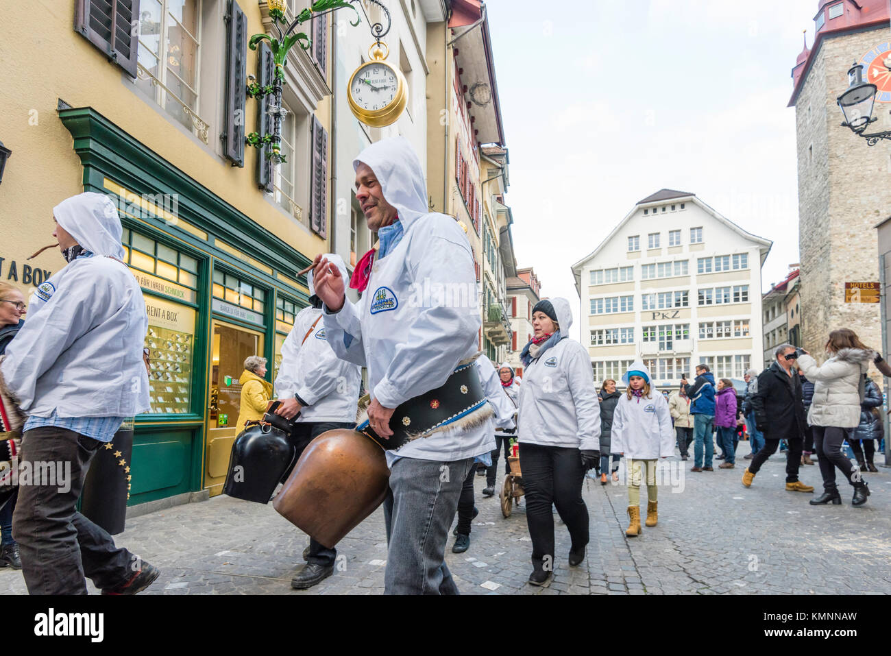 Lucerne, Switzerland - 2 Dec 2017: A group of traditional 'Trychler' men are striking their huge cowbells during the traditional Christmas parade. Stock Photo