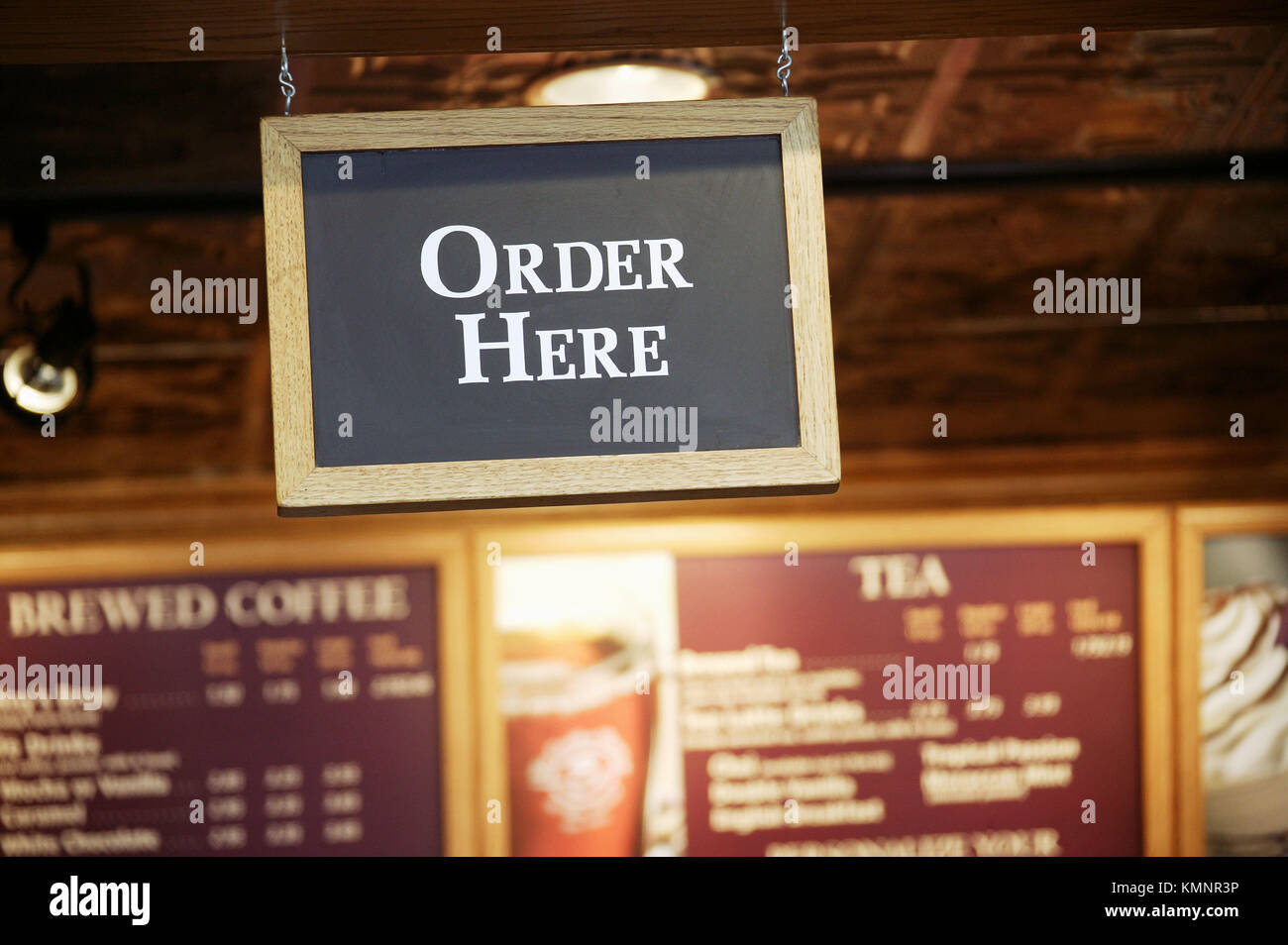 Order here sign Stock Photo - Alamy