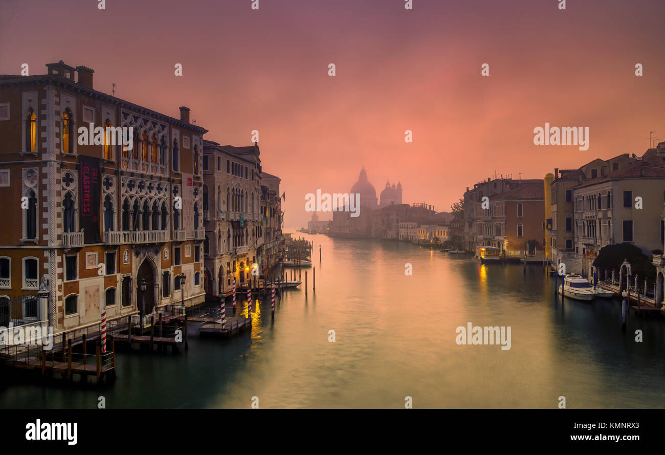 View on Venice: an early morning view from the Accademia Bridge in the mist, towards the church Santa Maria della Salute. Stock Photo