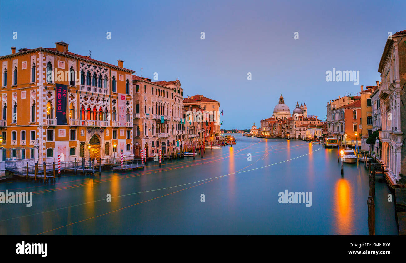 View on Venice: a view at dusk over the Canal Grande from the Accademia Bridge towards the church Santa Maria della Salute. Stock Photo