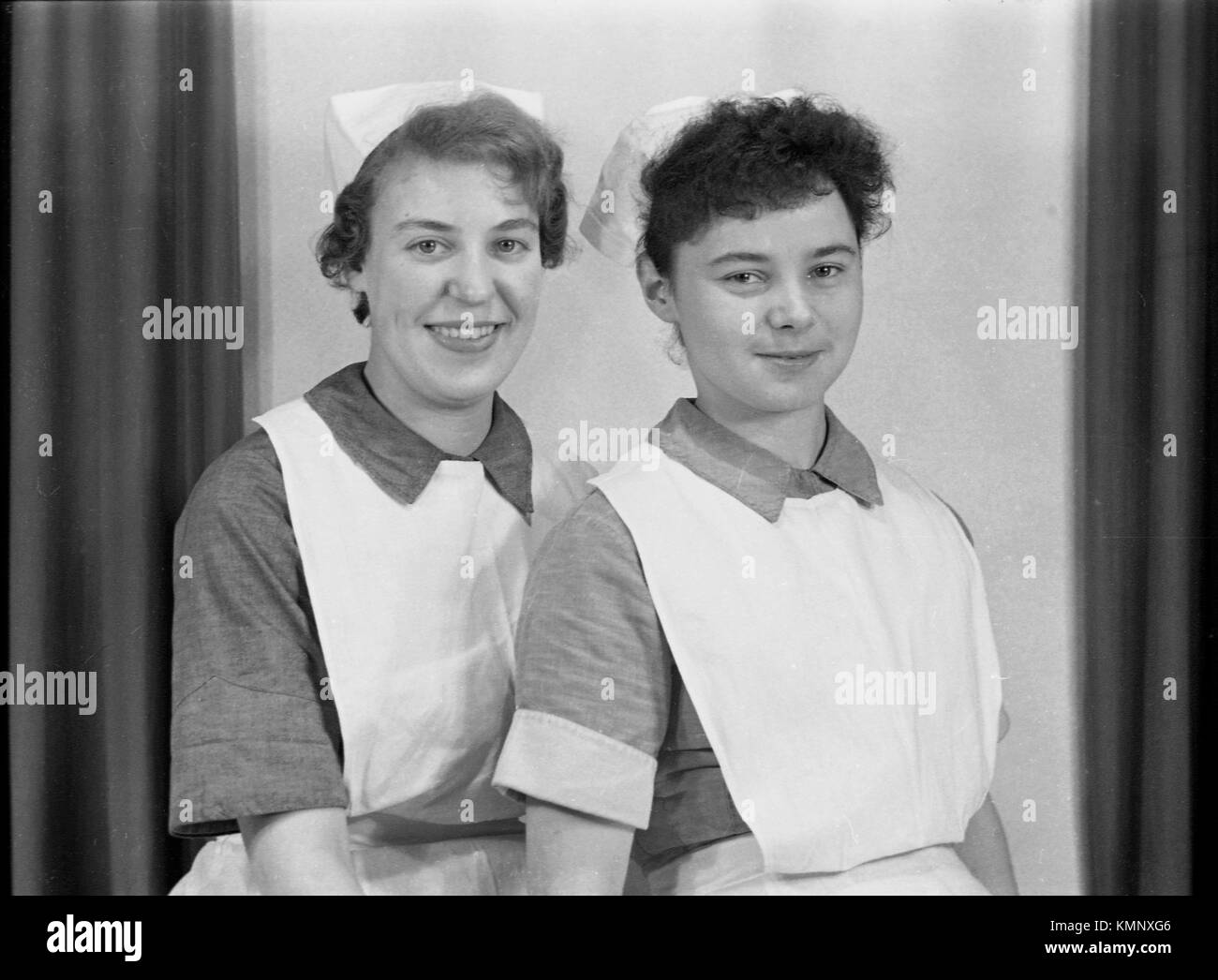 Two nurses pose c1950. Photograph by Tony Henshaw Stock Photo