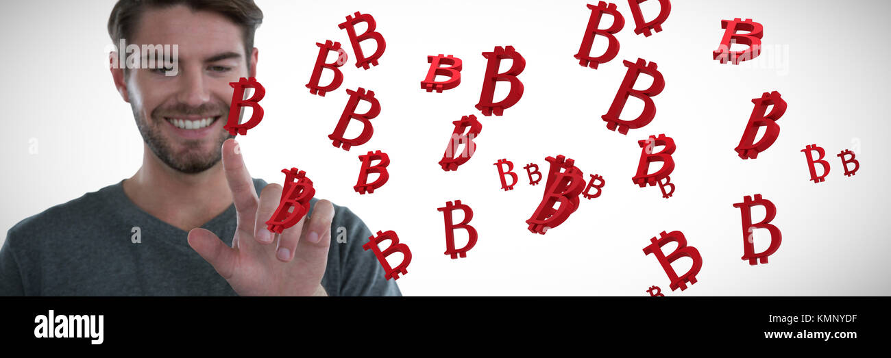 Man pretending to touch an invisible screen against several red bitcoin sign Stock Photo