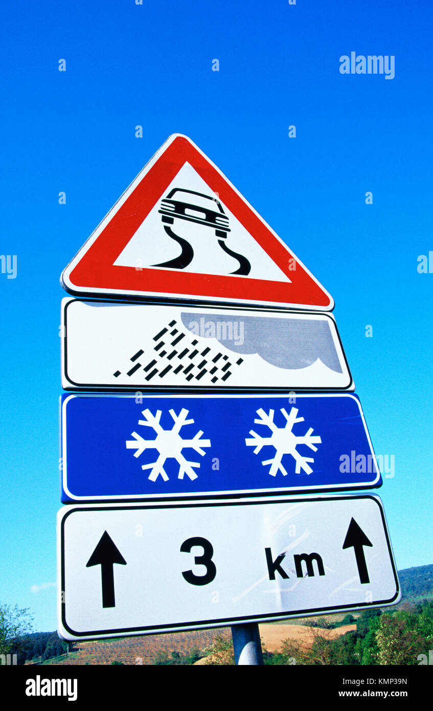 Traffic signs for slippery road, snow and rain. Tuscany. Italy Stock Photo